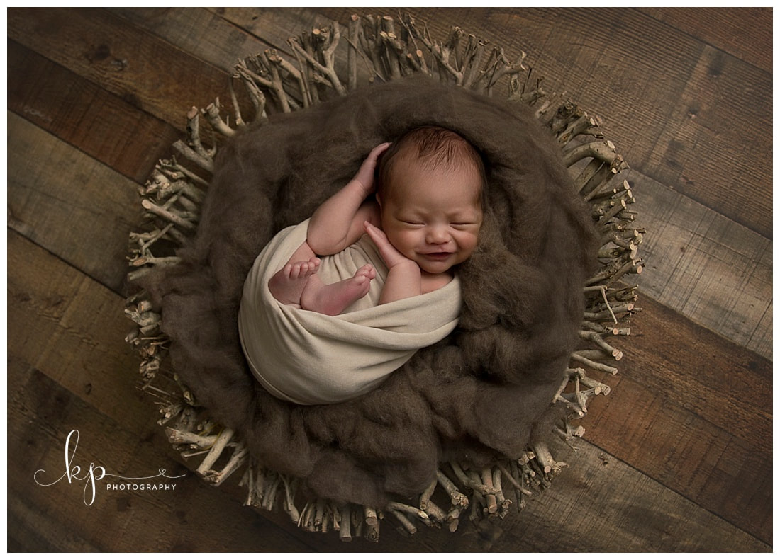 Newborn boy, newborn smiling, newborn basket pose, newborn posing, newborn photography